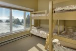 Bunk room with four twin beds in the guest house.